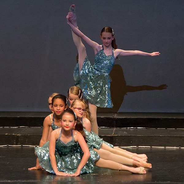 pre-teen dancers performing a combo routine