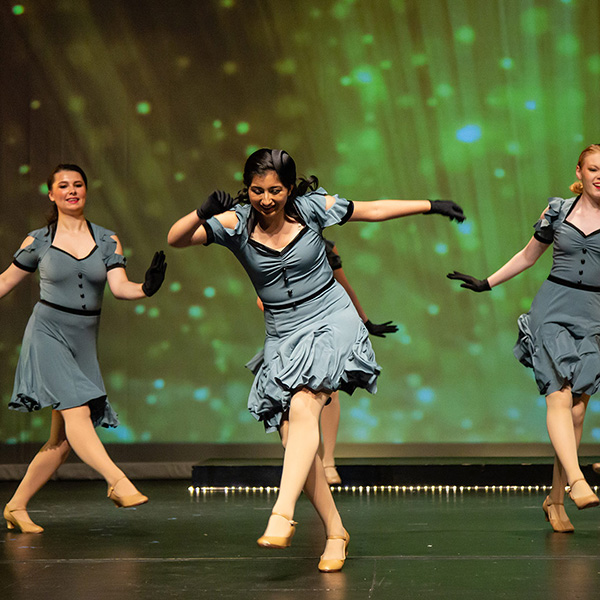 teenage dance students performing a tap and jazz routine